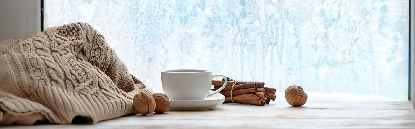 cozy winter season. cup of tea or coffee, sweater, cinnamon, nut